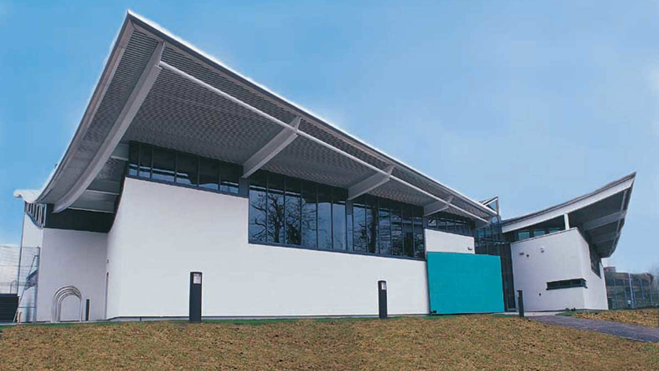 Exterior of Glasgow Club Donald Dewar, white building with blue sky 