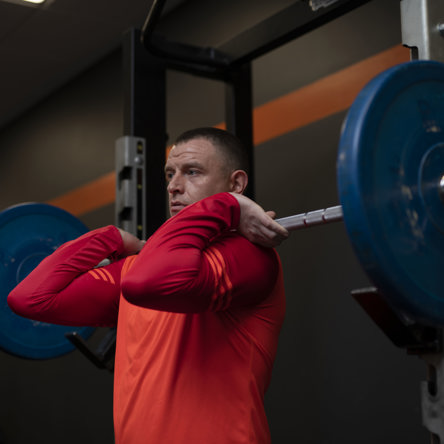 Glasgow Club member using barbell