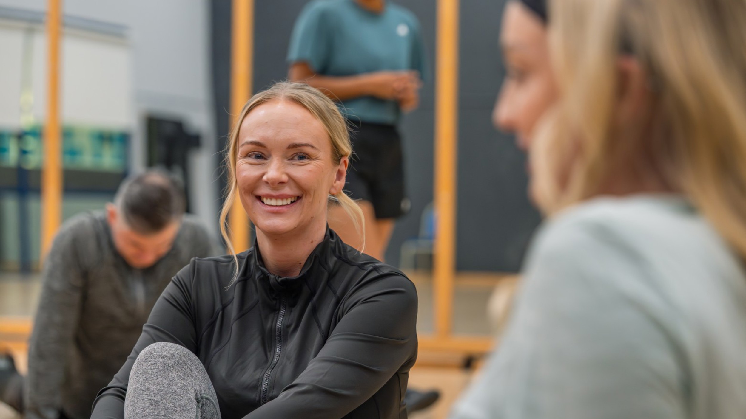 Glasgow Club members relaxing and chatting after a fitness class.