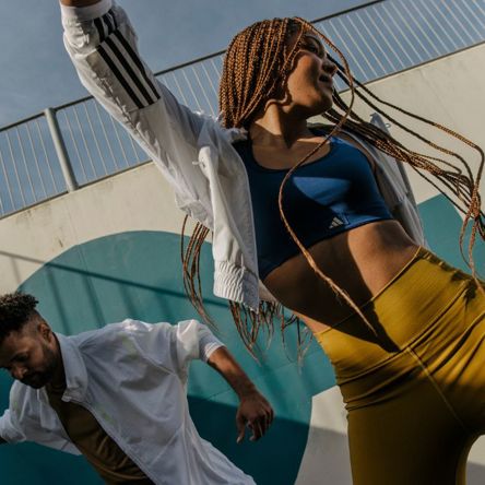 Two people dancing individually