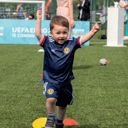 A kid taking part in mini kickers