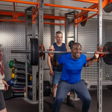 Glasgow Club members using barbell