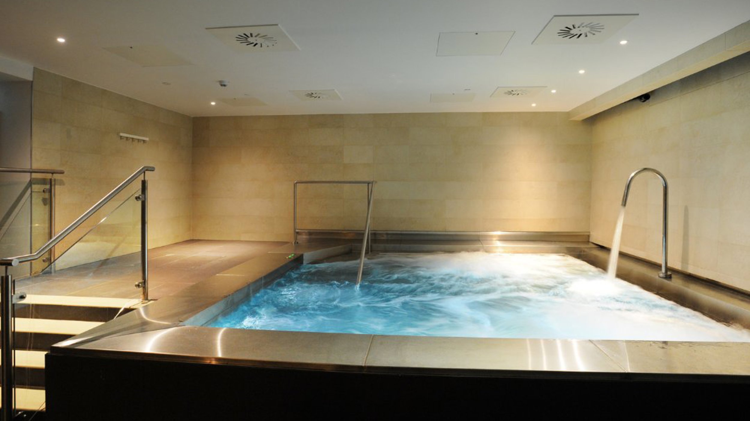A "vitality pool" or spa pool with bubbling water