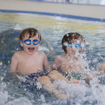 Two children swimming