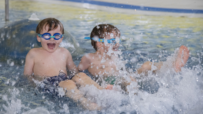 Two children swimming