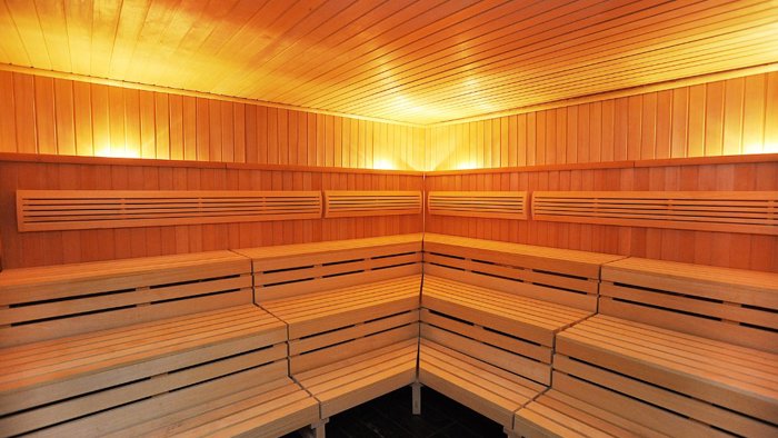 The interior wooden benches of a sauna