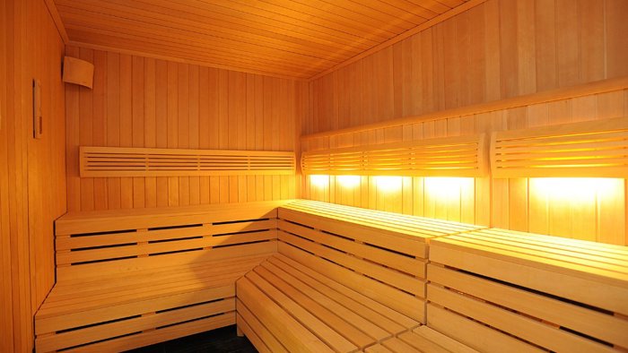 The interior wooden benches of a sauna