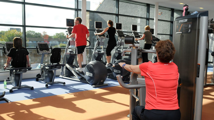 Glasgow Club Maryhill inside gym area with people on various equipment 