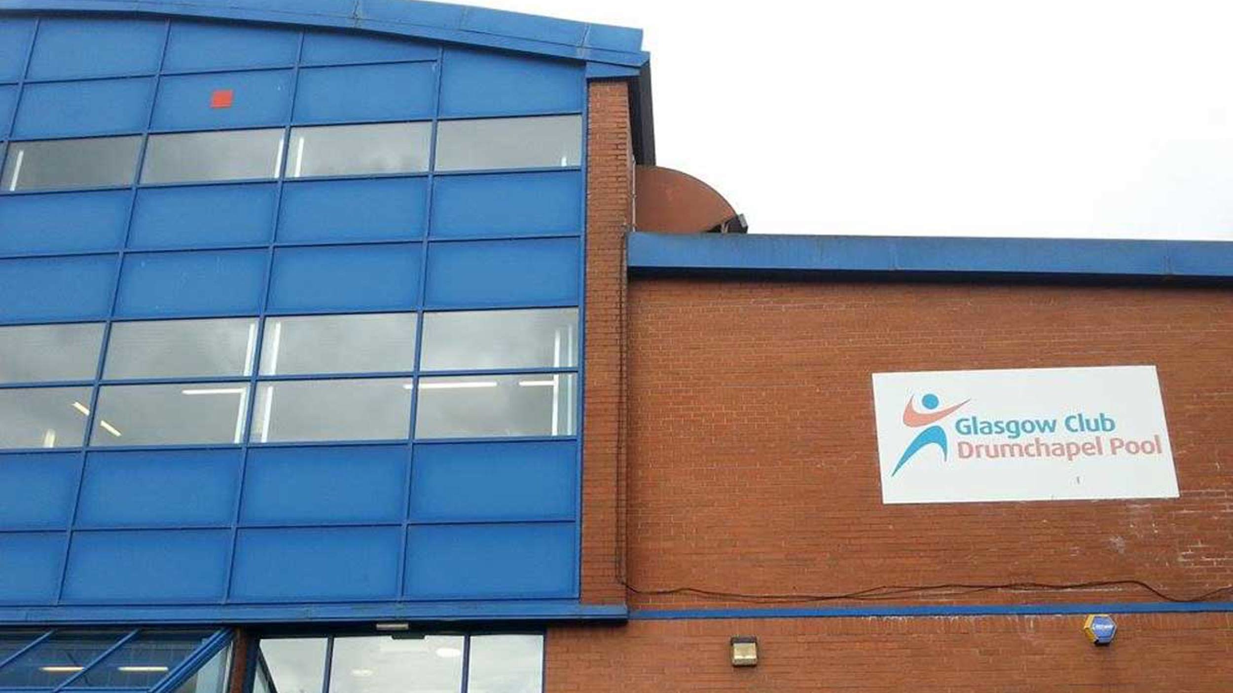 Exterior shot of Glasgow Club Drumchapel Pool showing logo on building 