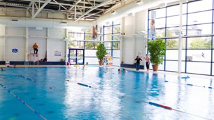 Swimming pool with glass windows behind inside Glasgow Club Gorbals